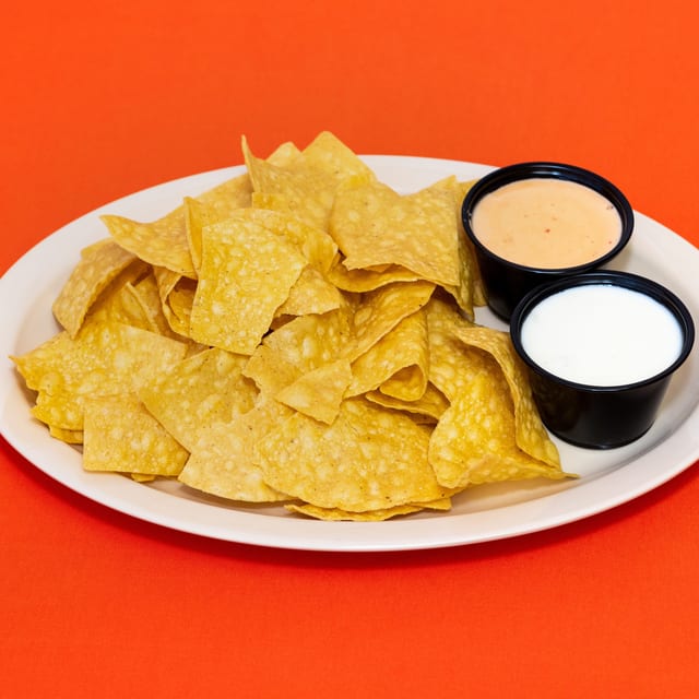Totopos con Salsa de Queso / Chips and Queso.